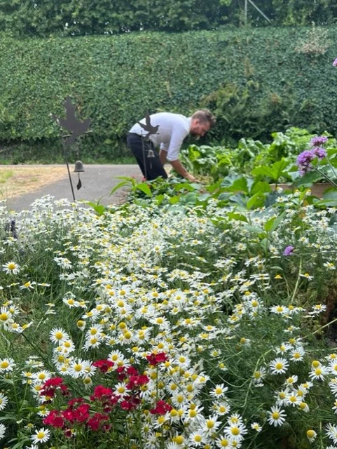 A staff member in the garden